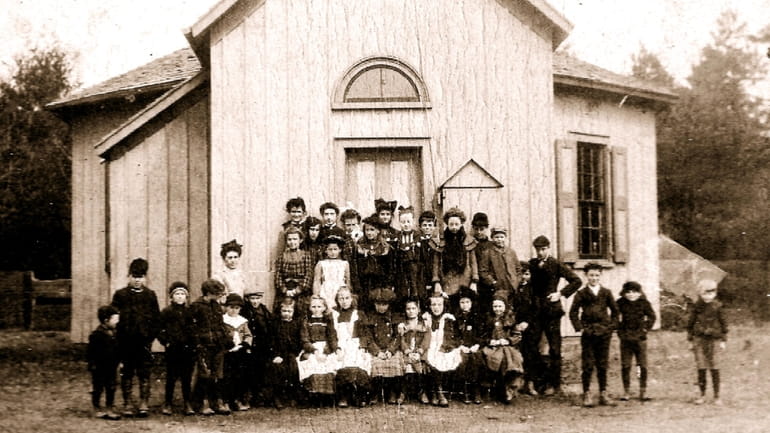 Schoolchildren in front of the Modern Times Schoolhouse in the...