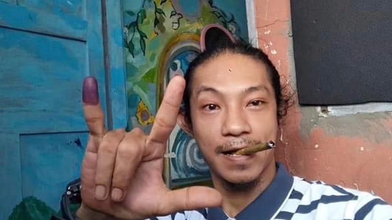 Burmese hip-hop artist Byu Har takes a selfie photo in...