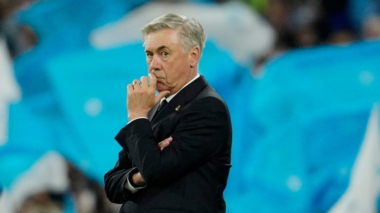 Real Madrid's head coach Carlo Ancelotti stands by the touchline...