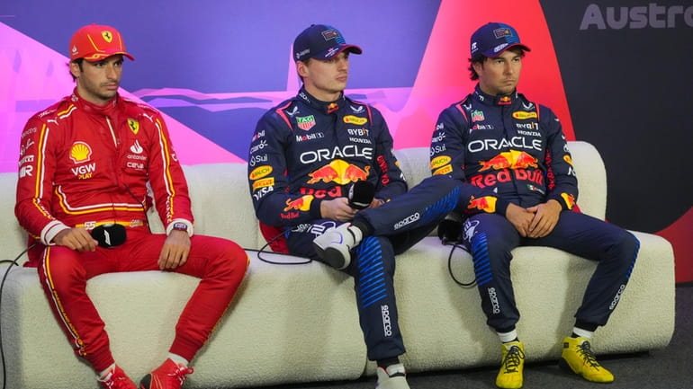 Fastest qualifier Red Bull driver Max Verstappen, centre, of the...