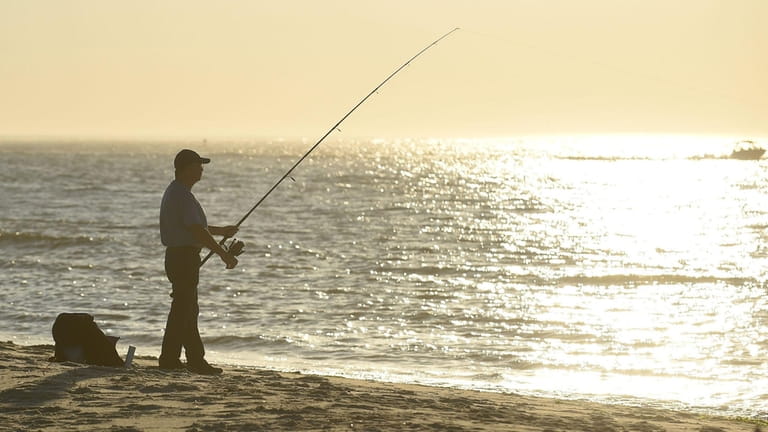 An angler fishes from Jones Beach West End 2 on...