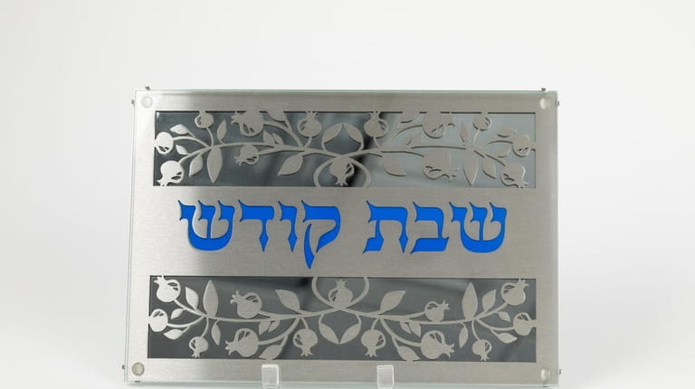 Stainless steel and enamel Challah platter designed by Carmit; $150 at...
