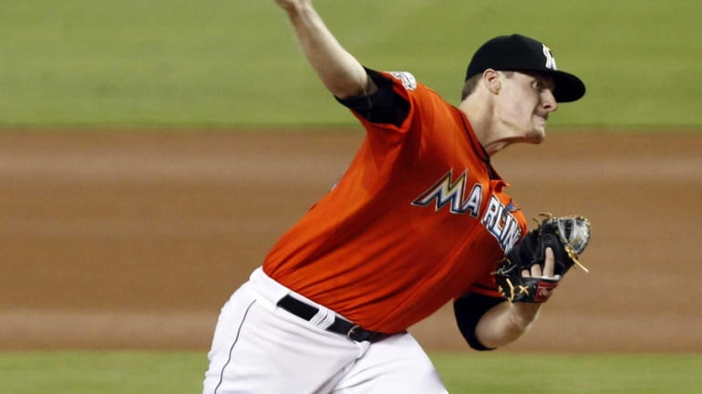Miami Marlins pitcher Tom Koehler delivers a pitch during a...