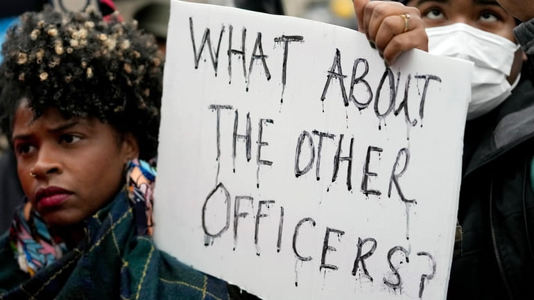Protesters march on Saturday in Memphis, Tenn., over the death...