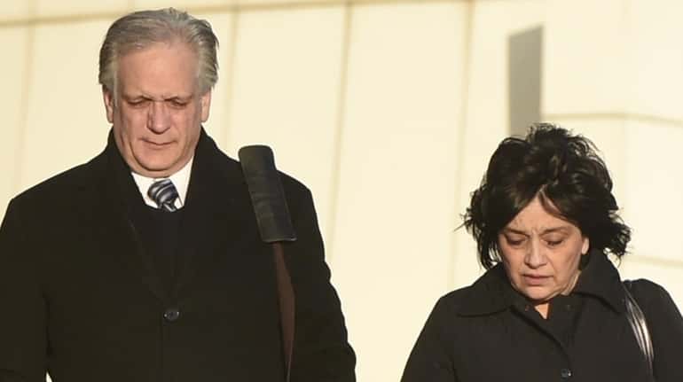 Edward and Linda Mangano leave federal court in Central Islip...