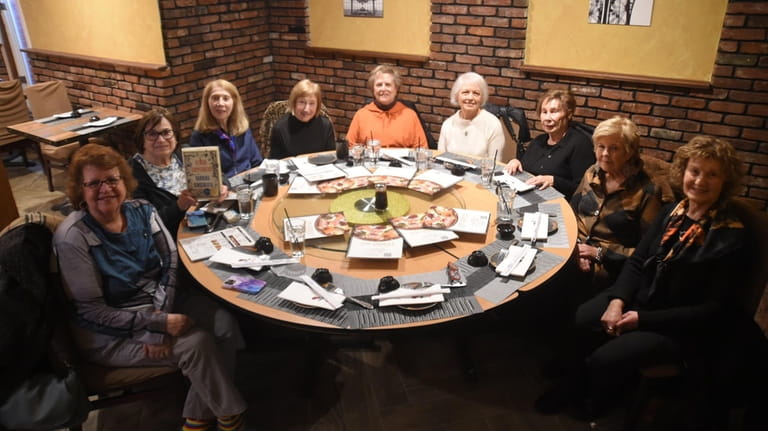 Members celebrate the book club's 50th anniversary.