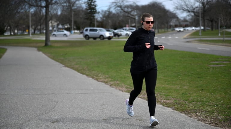 A jogger in Cedar Creek Park in Seaford. The family-oriented...