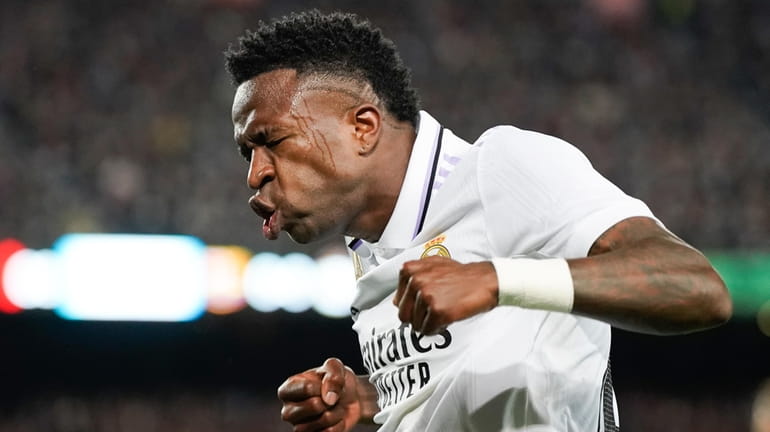 Real Madrid's Vinicius Junior celebrates after his team's first goal...