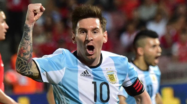 Argentina's Lionel Messi celebrates the team's second goal against Chile...