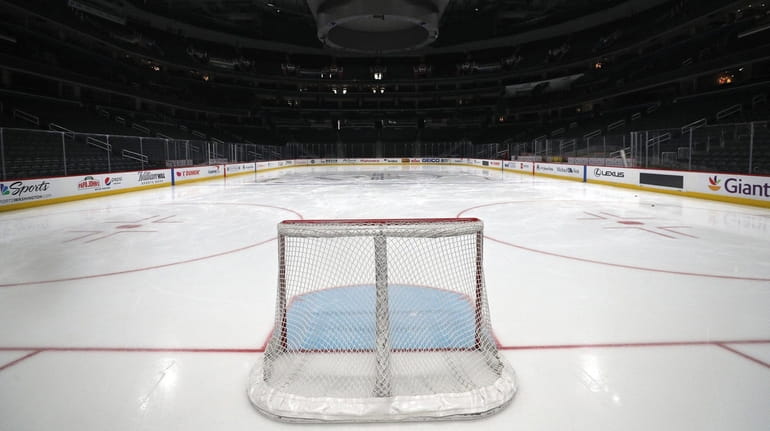 A goal sits on the empty ice prior to the...