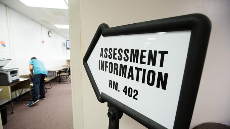A sign for assessment information is pictured at the Nassau...