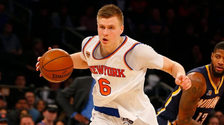 Kristaps Porzingis #6 of the New York Knicks controls the...