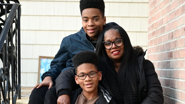 Noret Bazemore with sons Simon, in foreground, and Derik.