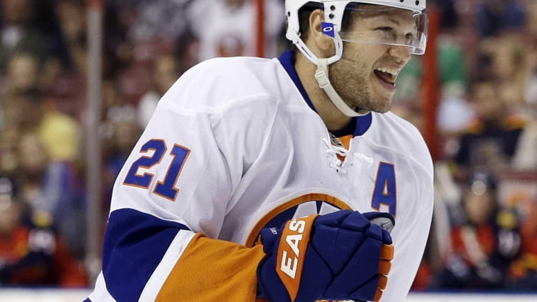 Islanders right wing Kyle Okposo celebrates after he scored a...