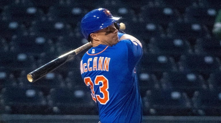 Mets' James McCann bats at The Ballpark of the Palm Beaches...