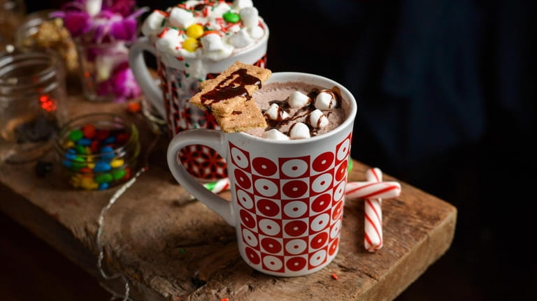 Spiked hot chocolate topped with marshmallows, graham crackers and chocolate syrup...