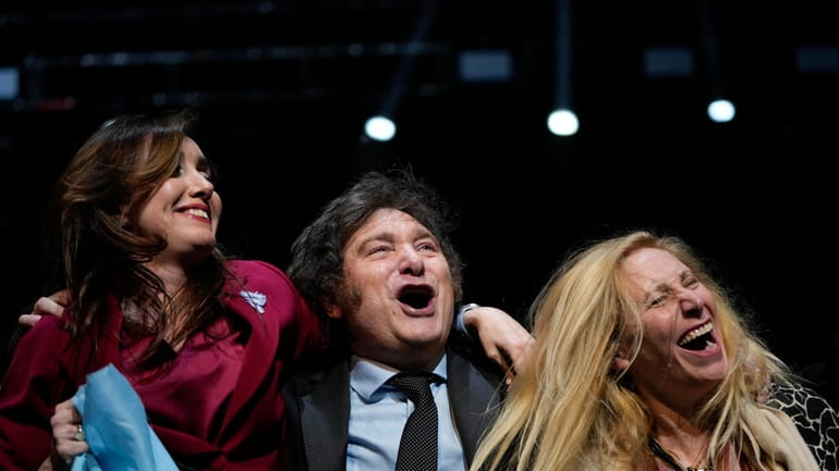 FILE- Presidential candidate Javier Milei, center, his sister Karina, right,...