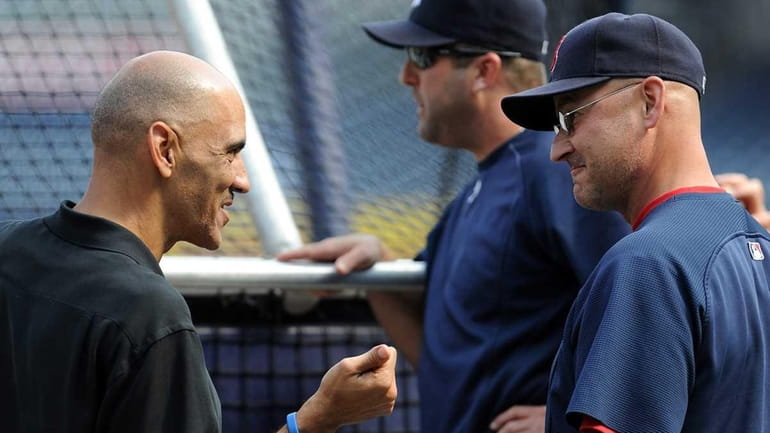 Former Indianapolis Colts coach Tony Dungy, left, greets Boston Red...
