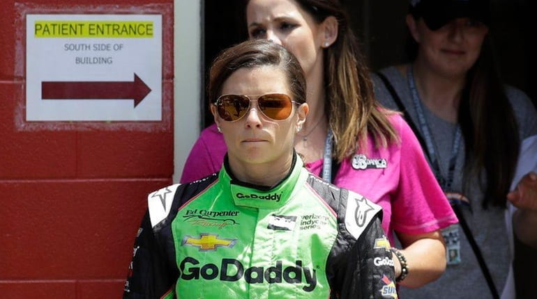 Danica Patrick leaves the infield hospital after being checked and...