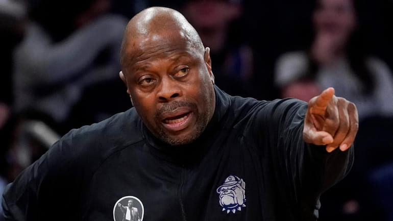 Georgetown head coach Patrick Ewing works the bench in the...