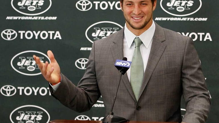 Quarterback Tim Tebow addresses the media as he is introduced...