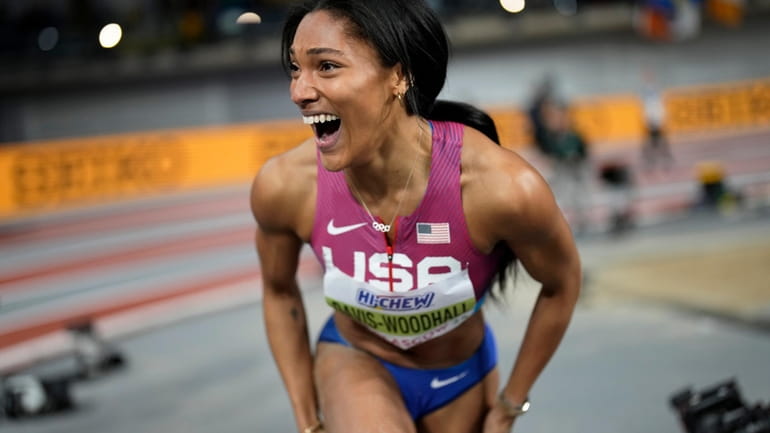 Tara Davis-Woodhall, of the United States, reacts after winning the...