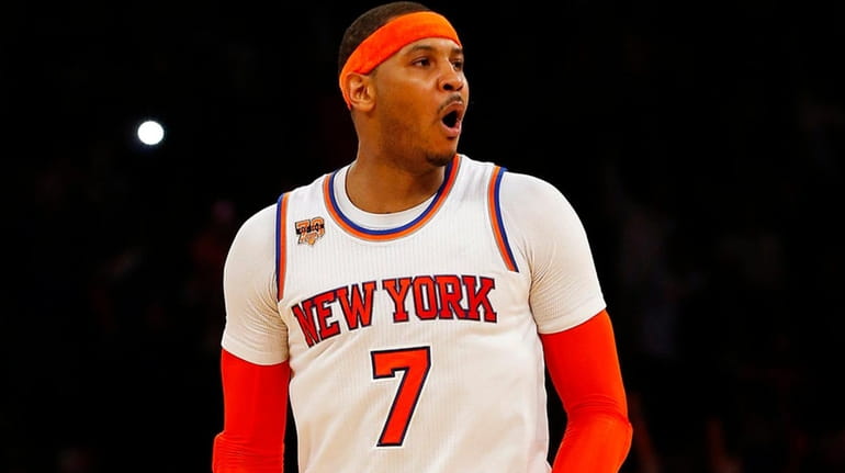 Carmelo Anthony of the New York Knicks reacts after a...