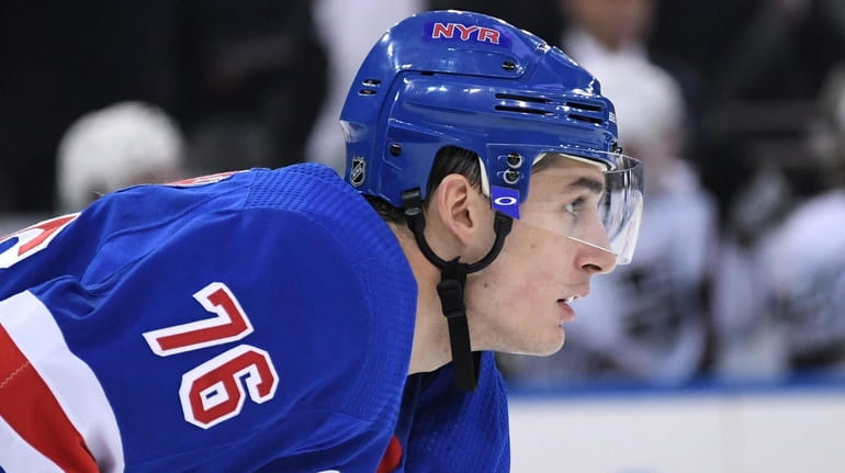 Rangers defenseman Brady Skjei sets before a face-off against the...