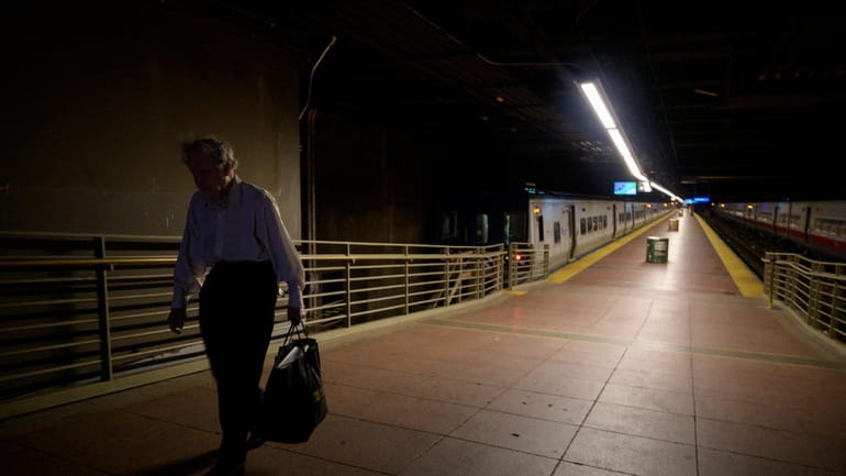 A commuter walks through Grand Central Station in Manhattan on...