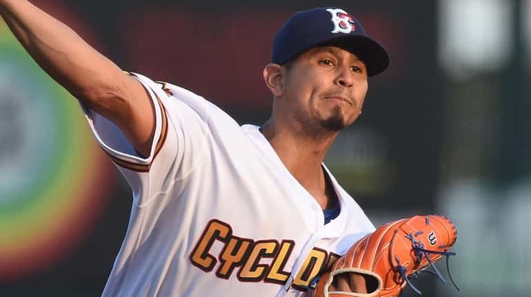 Carlos Carrasco of the Brooklyn Cyclones delivers to the plate during...