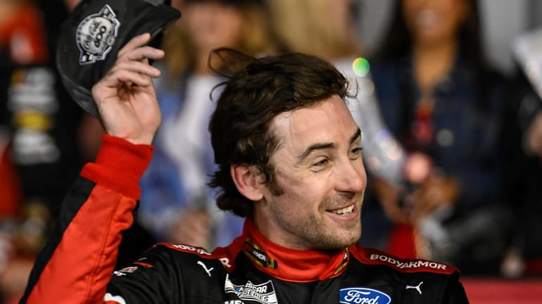 Ryan Blaney smiles in Victory Lane after winning a NASCAR...