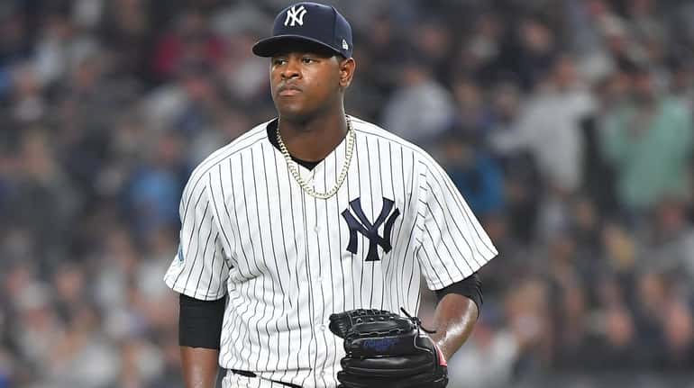 Yankees starting pitcher Luis Severino Looks on in the third...