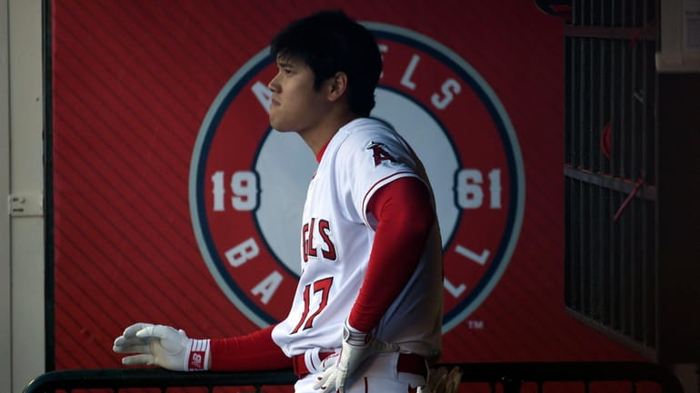 Angels designated hitter Shohei Ohtani looks on in the dugout...