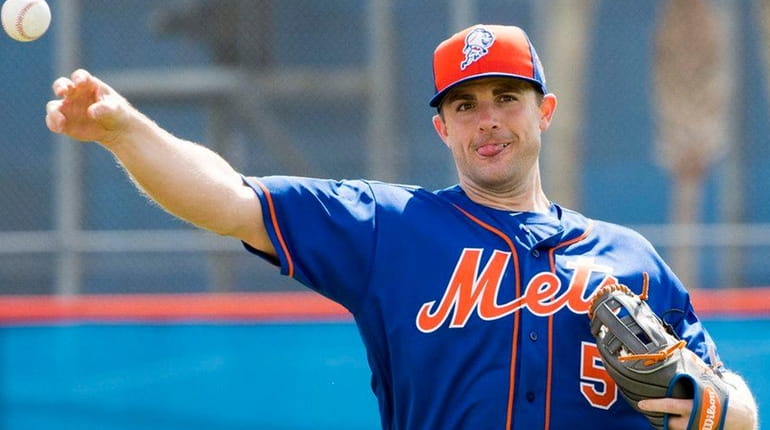 Mets infielder David Wright throws during a spring training workout...