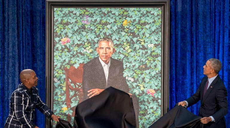 The portraits of President Barack Obama and Mrs. Michelle Obama...