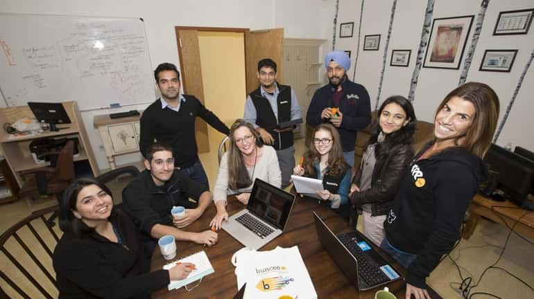 Marie Arturi, center, founder and CEO of Buncee, is surrounded...