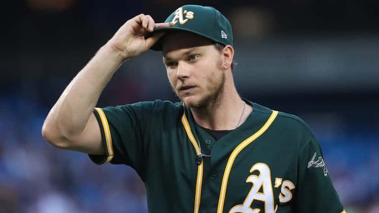 Sonny Gray of the A's walks to the dugout against...