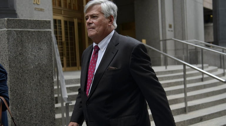 Dean Skelos exits a federal courthouse in Manhattan during his...