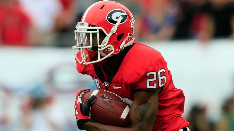 Georgia's Malcolm Mitchell runs for yardage during a game against...