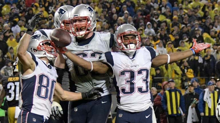 New England Patriots running back Dion Lewis celebrates his touchdown...
