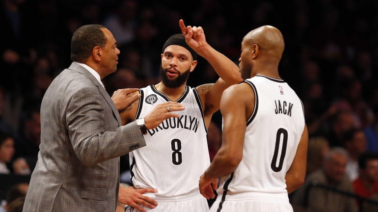 Head coach Lionel Hollins of the Brooklyn Nets talks with...