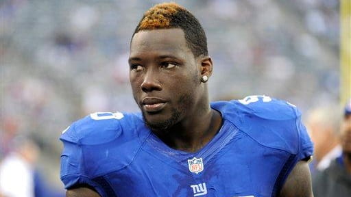 Jason Pierre-Paul looks on during the second half of a...