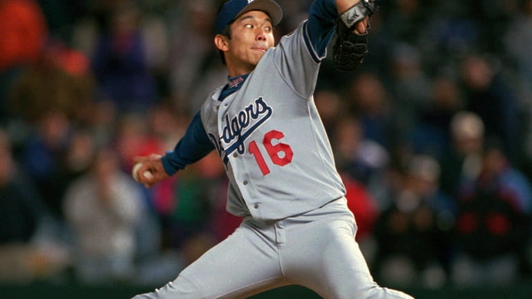 Los Angeles Dodgers starting pitcher Hideo Nomo delivers a pitch...