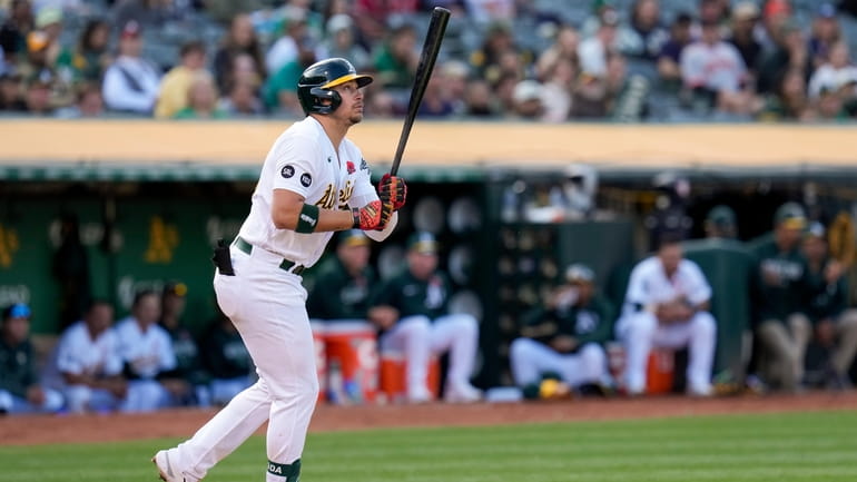 Oakland Athletics' Ryan Noda watches his three-run home run against...