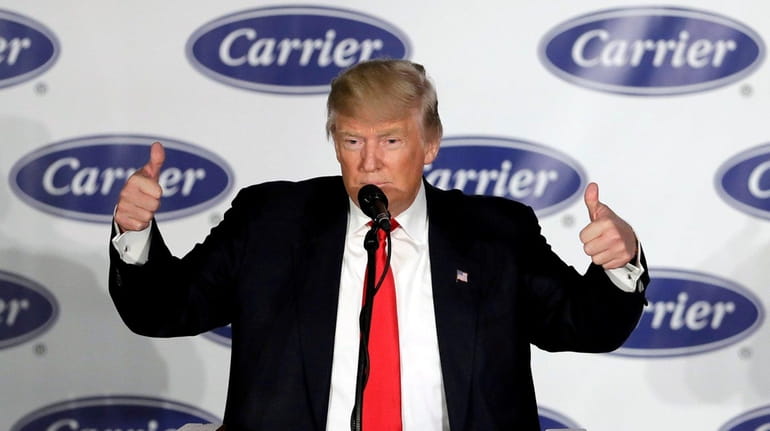 President-elect Donald Trump reacts after speaking at Carrier Corp., Dec....