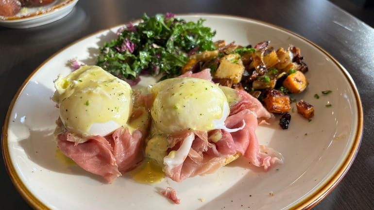 Perfectly poached eggs Benedict with prosciutto at Twisted Fork Brunch...