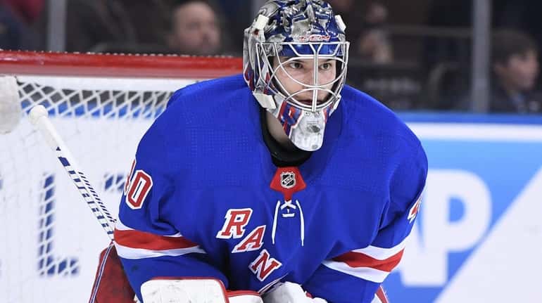 New York Rangers goaltender Alexandar Georgiev looks on against the...