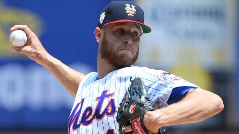 New York Mets starting pitcher Zack Wheeler delivers against the...