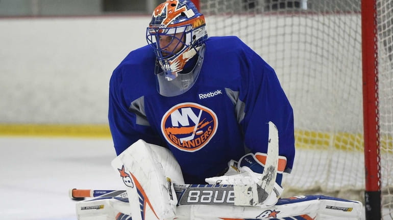 New York Islanders goalie Jaroslav Halak protects the net during...