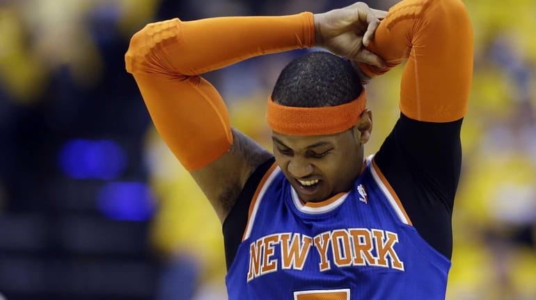 Knicks' Carmelo Anthony stretches during the first half of Game...